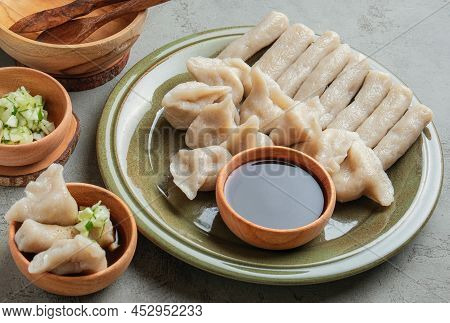 Pempek Served On Grey Unfinished Cement Table. Pempek Is Traditional Food From Indonesia. Made Of Fi