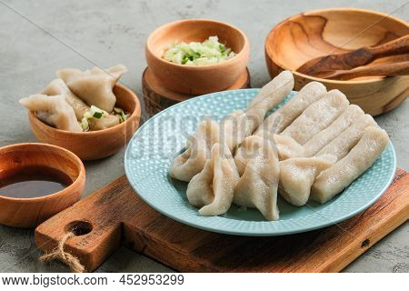 Pempek Served On Grey Unfinished Cement Table. Pempek Is Traditional Food From Indonesia. Made Of Fi