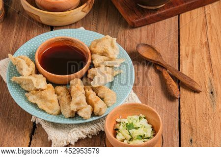 Pempek Served On Rustic Wooden Table. Pempek Is Traditional Food From Indonesia. Made Of Fish And Ta