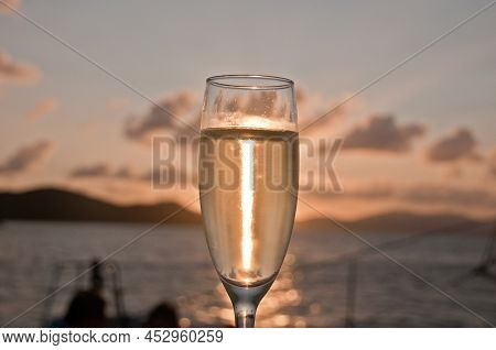 Bubby Sparkling Champagne Flute Glass With Sunset Evening Scene While Sailing In The Pacific Ocean I