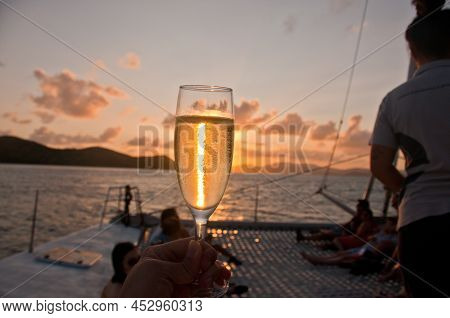 Bubby Sparkling Champagne Flute Glass With Sunset Evening Scene While Sailing In The Pacific Ocean I