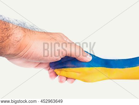 An Adult Shook Hands With A Child Who Painted The Ukrainian Flag On His Arm,isolated On White Backgr