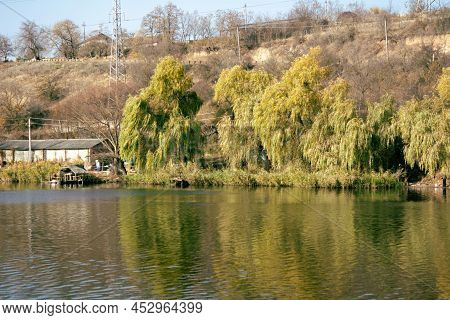 View Of The River Yagorlyk. Yagorlyk River In Moldova. Unidentified Fishermen Are Fishing On The Ban