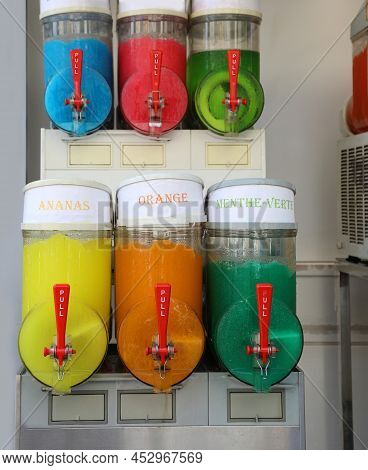 Alfresco Iced Grenadine Dispenser With Pineapple Orange And Mint Flavors Written In French Language