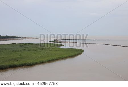 Mouth Of River Called Fiume Adige In Northern Italy And The Adriatic Sea