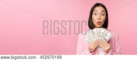 Finance, Microcredit And People Concept. Happy Smiling Asian Businesswoman Showing Dollars Money, St