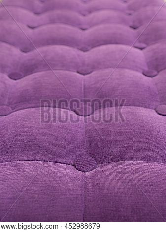 Upholstery Of Velour Buttoned Purple Violet Color Fabric, Wall Pattern. Elegant Vintage Quilted Sofa
