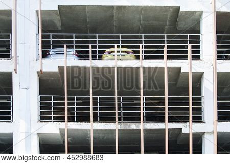 Cars Are Parked In An Open Multi-level Parking Lot