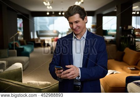 Handsome Interior Designer, Businessman Typing Message On Mobile Phone, Visiting A Furniture Store S