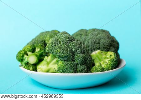 Broccoli Of Fresh Green Broccoli In Bowl Over Coloredbackground. , Close Up. Fresh Vegetable.