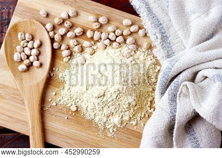 Organic Homemade Chickpea Flour Over Rustic Wooden Table. Gluten Free