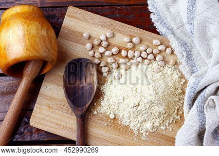 Organic Homemade Chickpea Flour Over Rustic Wooden Table. Gluten Free
