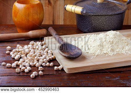 Organic Homemade Chickpea Flour Over Rustic Wooden Table. Gluten Free