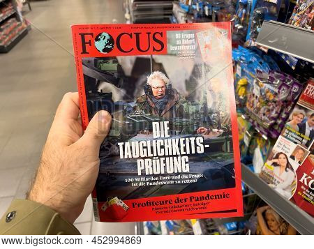 Frankfurt, Germany - Ap 2, 2022: Pov Male Hand-holding In Newspaper Kiosk Latest Edition Of The Germ
