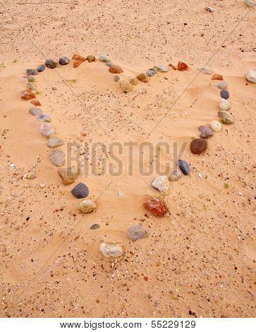 Heart Of Sea Stones On Sand