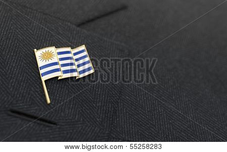 Uruguay Flag Lapel Pin On The Collar Of A Business Suit