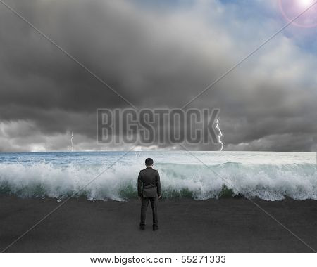 Businessman Standing Toward Waves And Cludy Sky With Lightning , Thunder To Challenge Dangerous Situ