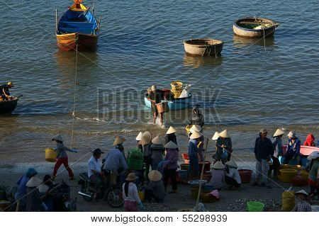 People Buy And Sale Seafood At Market On Baach
