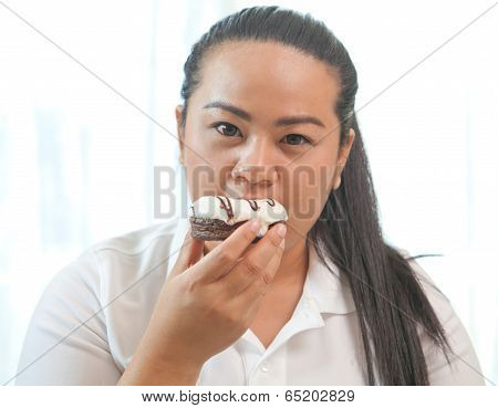 Woman Eating A Donut
