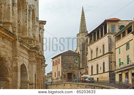 Tower Of The College Saint Charles And The Wall Of The Old Roman Amphitheatre In Arles, France.