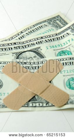 Bandaged dollar bill symbolizing the nation's debt