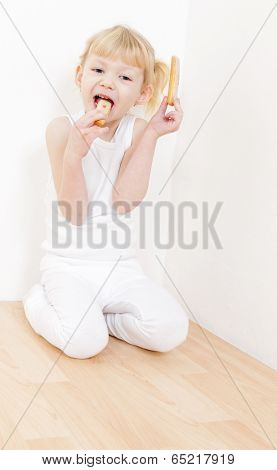little girl eating buscuit