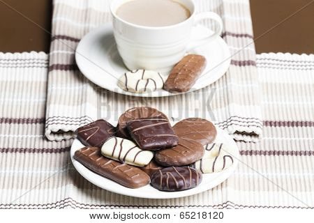cup of coffee with chocolete biscuits
