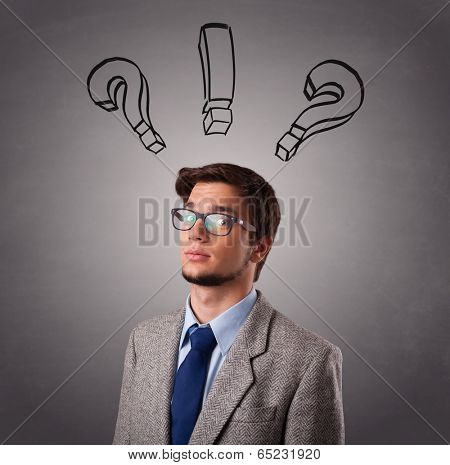 Young man standing and thinking with question marks overhead