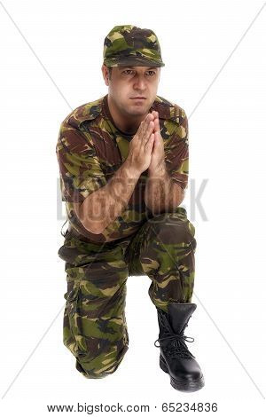 Soldier Who Makes The Gesture Of Prayer