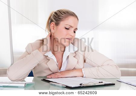 Businesswoman Suffering From Neck Pain