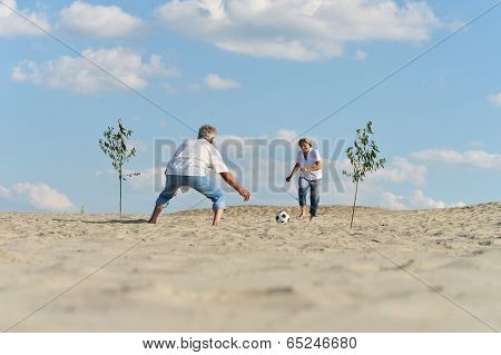 Couple playing football