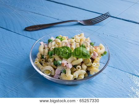 Pasta Salad In A Glass Bowl On Blue Wood
