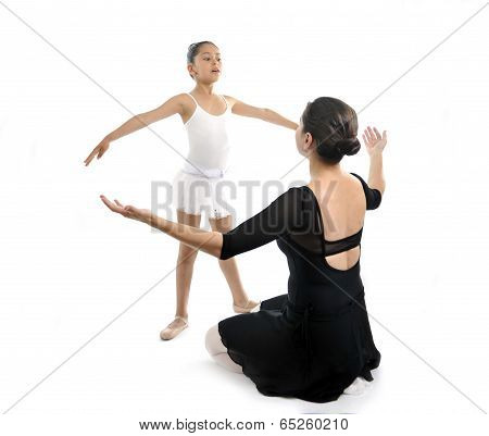 Young Little Girl Ballerina Learning Dance Lesson With Ballet Teacher