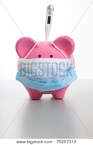 Piggy Bank With Mask And Thermometer - Swine Flu Concept