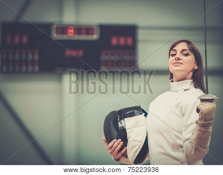 Young woman fencer with epee 