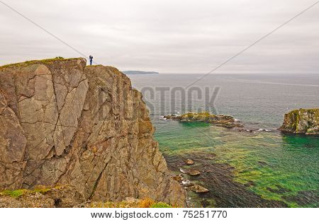 Observer On A Rocky Ocean Coast
