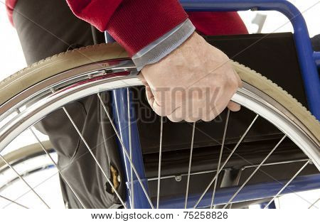 Wheelchair user makes various movements with his wheelchair, exercises for safety handling