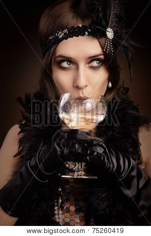 Retro 20s style woman drinking champagne