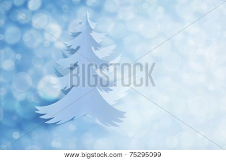 White Handmade Paper cut Christmas Tree - defocused light background with copy space for text 