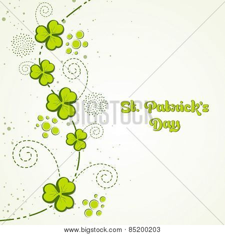 Elegant greeting card design with Irish lucky green clover leaves for Happy St. Patrick's Day celebration. 