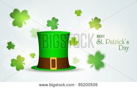 Glossy Leprechaun hat on clover leaves decorated background for Happy St. Patrick's Day celebration.