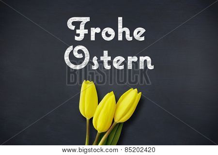 Yellow tulips against frohe ostern