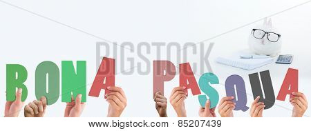 Hands holding up bona pasqua against white bunny wearing human glasses with stationary and calculator