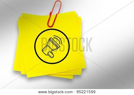 Megaphone graphic against sticky note with red paperclip
