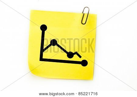 Graph against sticky note with grey paperclip