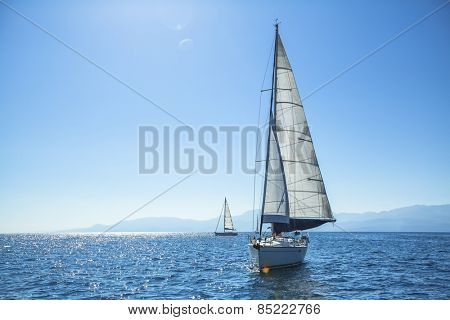 Boat competitor of sailing regatta in clear sunny weather. Luxury yachts.