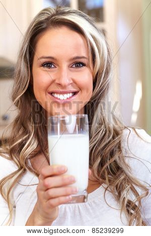 Young woman drinking milk. Health and diet.