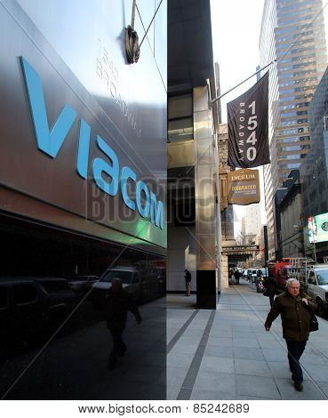 NEW YORK CITY - FEB. 25, 2015:  A pedestrian walks past the headquarters of Viacom. Viacom, Inc. is an American global mass media company

