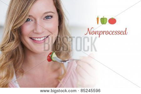 The word nonprocessed against closeup of woman having salad