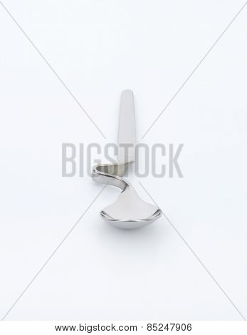 empty squiggly spoon on white background